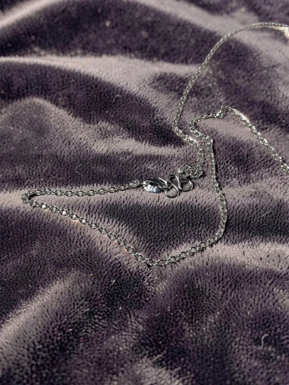 vintage Chrystal lined spiraled curled cross on a .925 sterling necklace